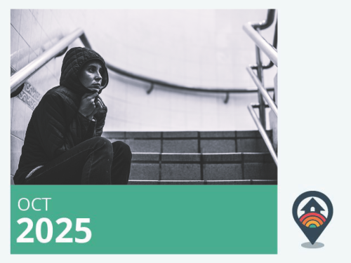 Woman sitting in an empty stairwell